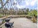 Outdoor deck with grill overlooks the creek and woods at 132 Tranquil Ln, Ladson, SC 29456