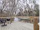 Outdoor deck with grill overlooks the creek and woods at 132 Tranquil Ln, Ladson, SC 29456