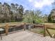Outdoor deck overlooks the creek and backyard at 132 Tranquil Ln, Ladson, SC 29456