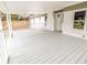 Open back porch showcasing the neutral paint and brick accents of the house at 132 Tranquil Ln, Ladson, SC 29456