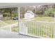 View from porch overlooking backyard, with large shed and partial fencing at 132 Tranquil Ln, Ladson, SC 29456