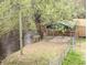 Riverfront home with backyard featuring a sandy play area and seating under a metal canopy at 132 Tranquil Ln, Ladson, SC 29456