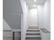 Basement steps lead to open door and bench seating at 132 Tranquil Ln, Ladson, SC 29456