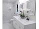 Updated bathroom with double vanity, marble tiled shower, and decorative mirrors at 132 Tranquil Ln, Ladson, SC 29456