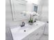 Bathroom with double vanity sinks, white cabinets, and modern black fixtures at 132 Tranquil Ln, Ladson, SC 29456