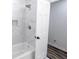 Updated bathroom with tub and shower and white door at 132 Tranquil Ln, Ladson, SC 29456