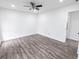 Spacious bedroom features hardwood floors, neutral paint, and ceiling fan at 132 Tranquil Ln, Ladson, SC 29456