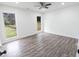 Bedroom with wood-look flooring, natural light from the windows, and ceiling fan at 132 Tranquil Ln, Ladson, SC 29456