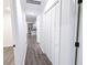 Hallway with hardwood floors, storage, and open floor plan at 132 Tranquil Ln, Ladson, SC 29456