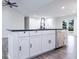 Kitchen island featuring a sink, storage, and a dishwasher, perfect for meal preparation at 132 Tranquil Ln, Ladson, SC 29456