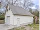 Exterior view of shed, highlighting access door and partial staircase to the upper level at 132 Tranquil Ln, Ladson, SC 29456