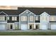 Charming townhome featuring craftsman-style architecture, attached garages, and manicured landscaping at 133 Haventree Ct, Summerville, SC 29486