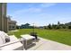 Outdoor patio area with comfortable seating and a view of the spacious backyard at 133 Headwater Dr, Summerville, SC 29486