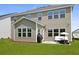 Back of the home featuring a patio, barbecue, and ample green space at 133 Headwater Dr, Summerville, SC 29486