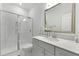 Modern bathroom with a glass-enclosed shower and a stylish vanity with a decorative mirror at 133 Headwater Dr, Summerville, SC 29486