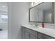 Modern bathroom with gray vanity and a large mirror, offering a sleek aesthetic at 133 Headwater Dr, Summerville, SC 29486