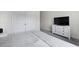 Bedroom with soft gray carpet, TV on dresser, and closet visible through the doorway at 133 Headwater Dr, Summerville, SC 29486