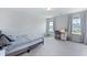 Bright, carpeted bedroom with two windows and neutral tones, creating a calm space at 133 Headwater Dr, Summerville, SC 29486