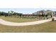 The neighborhood pool is surrounded by a fence and lounge chairs with a sidewalk leading up to it at 133 Headwater Dr, Summerville, SC 29486