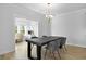 Modern dining room featuring stylish lighting and table, with a view of the bright office space at 133 Headwater Dr, Summerville, SC 29486