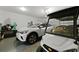 Spacious garage featuring an electric car, golf cart, and ample storage space at 133 Headwater Dr, Summerville, SC 29486