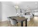 Open-concept kitchen featuring gray cabinets, stainless steel appliances and a dining table at 133 Headwater Dr, Summerville, SC 29486