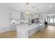 Bright kitchen boasting a large island, stainless steel appliances, and white cabinetry at 133 Headwater Dr, Summerville, SC 29486