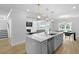 Modern kitchen featuring a large island, stainless steel appliances, and an open floorplan at 133 Headwater Dr, Summerville, SC 29486