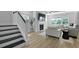 Bright living room featuring a fireplace, staircase and hardwood floors with neutral decor at 133 Headwater Dr, Summerville, SC 29486