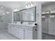 Bright main bathroom with double vanity, marble countertop, and glass-enclosed shower; a spa-like retreat at 133 Headwater Dr, Summerville, SC 29486