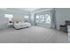 Bright and airy main bedroom with plush carpet, large windows, and stylish decor; perfect for relaxation at 133 Headwater Dr, Summerville, SC 29486