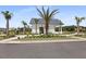 A pool house has a metal roof, white siding, and palm trees surrounding the building at 133 Headwater Dr, Summerville, SC 29486