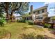 Lush backyard with a treehouse, a spacious lawn, and a well-maintained deck at 1330 Somersby Ln, Mount Pleasant, SC 29466