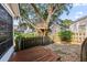 Secluded backyard featuring wooden fence, treehouse, stone pathway, and exterior of house at 1330 Somersby Ln, Mount Pleasant, SC 29466