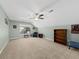 Spacious bonus room with neutral carpet, ceiling fan, and ample natural light from a window at 1330 Somersby Ln, Mount Pleasant, SC 29466