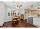 Bright dining area features plantation shutters and elegant wood flooring at 1330 Somersby Ln, Mount Pleasant, SC 29466