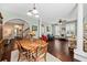 Elegant dining space featuring hardwood floors, an ornate wooden table, and plenty of natural light with a view to living area at 1330 Somersby Ln, Mount Pleasant, SC 29466