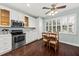 Bright kitchen featuring stainless appliances, white cabinets and a dining area at 1330 Somersby Ln, Mount Pleasant, SC 29466
