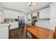 Beautifully lit kitchen with white cabinetry, stainless steel appliances, and a cozy dining table at 1330 Somersby Ln, Mount Pleasant, SC 29466