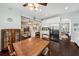 Open-concept kitchen with stainless steel appliances, white cabinetry, and a dining table at 1330 Somersby Ln, Mount Pleasant, SC 29466