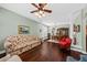 Bright living room featuring hardwood floors, decorative columns, and colorful furniture with a view to the dining area at 1330 Somersby Ln, Mount Pleasant, SC 29466