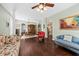 Inviting living space with rich hardwood floors, complemented by elegant furnishings and views to the dining area at 1330 Somersby Ln, Mount Pleasant, SC 29466