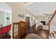 View of open-concept living space with dark hardwood floors, classic furniture, and decorative artwork and details at 1330 Somersby Ln, Mount Pleasant, SC 29466