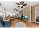 Bright sunroom with wood look flooring, comfortable seating, and plenty of light at 1330 Somersby Ln, Mount Pleasant, SC 29466