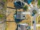 An aerial view showing the layout of a residential property, including its yard, driveway, and adjacent homes at 136 Stagecoach Ln, Summerville, SC 29483