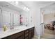 Stylish bathroom features dual sinks, dark wood cabinets, and a large mirror above the countertop at 136 Stagecoach Ln, Summerville, SC 29483