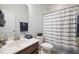 Cozy bathroom featuring a vanity with white countertops, a neutral color palette, and a striped shower curtain at 136 Stagecoach Ln, Summerville, SC 29483