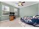 Bright bedroom with two windows, a ceiling fan, and a comfortable bed with floral bedding, perfect for relaxation at 136 Stagecoach Ln, Summerville, SC 29483