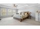 Inviting primary bedroom with large windows, ceiling fan, and a comfortable bed and nightstands at 136 Stagecoach Ln, Summerville, SC 29483