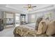 Bright primary bedroom boasts large windows, a mirrored door, and a calming and inviting color scheme at 136 Stagecoach Ln, Summerville, SC 29483